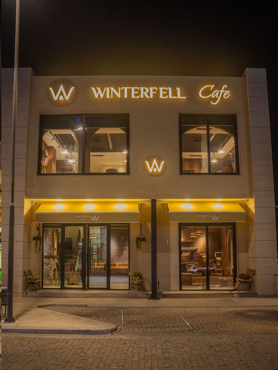 Winterfell Cafe storefront at night